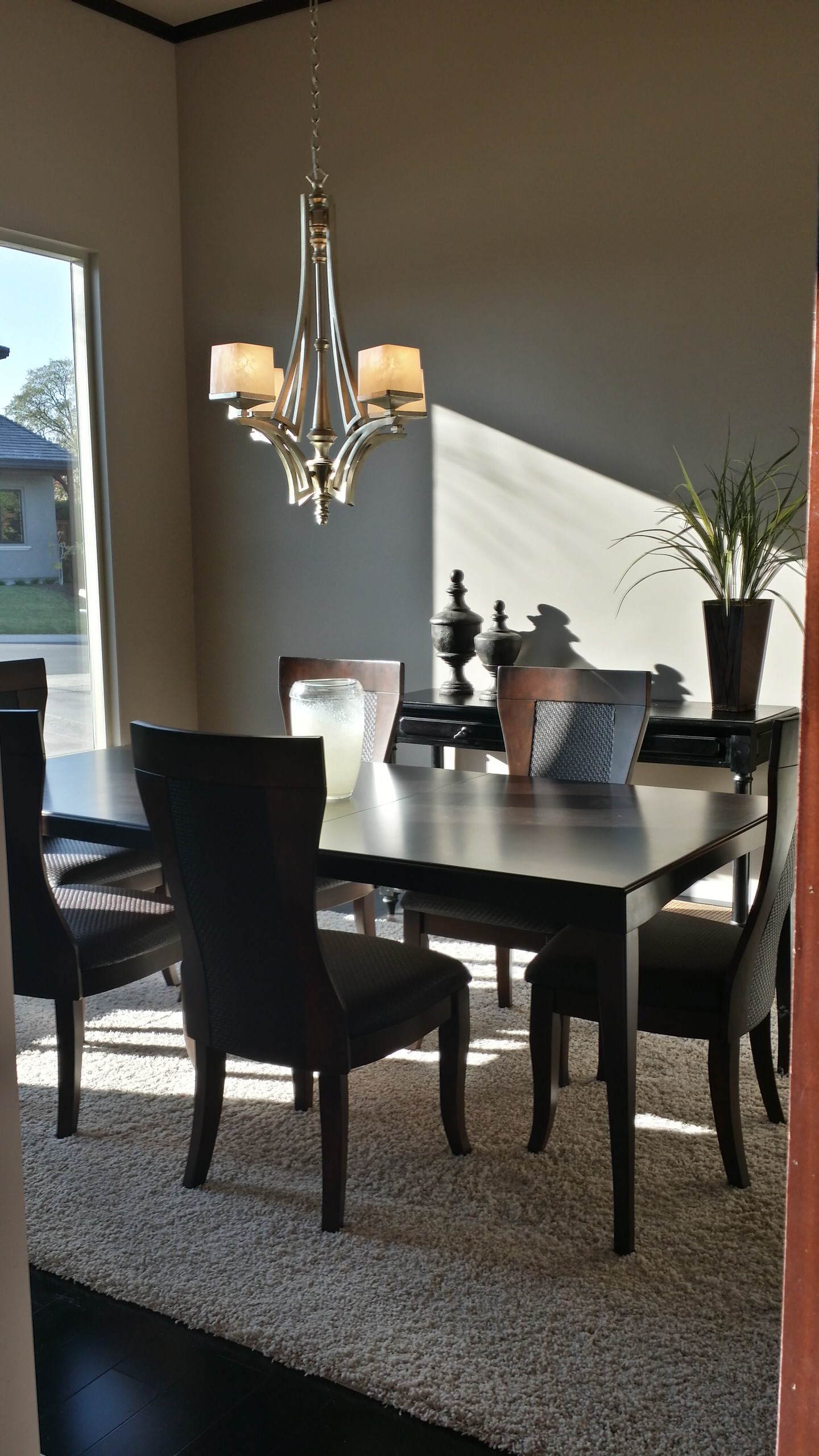 Dining area beside broad windows