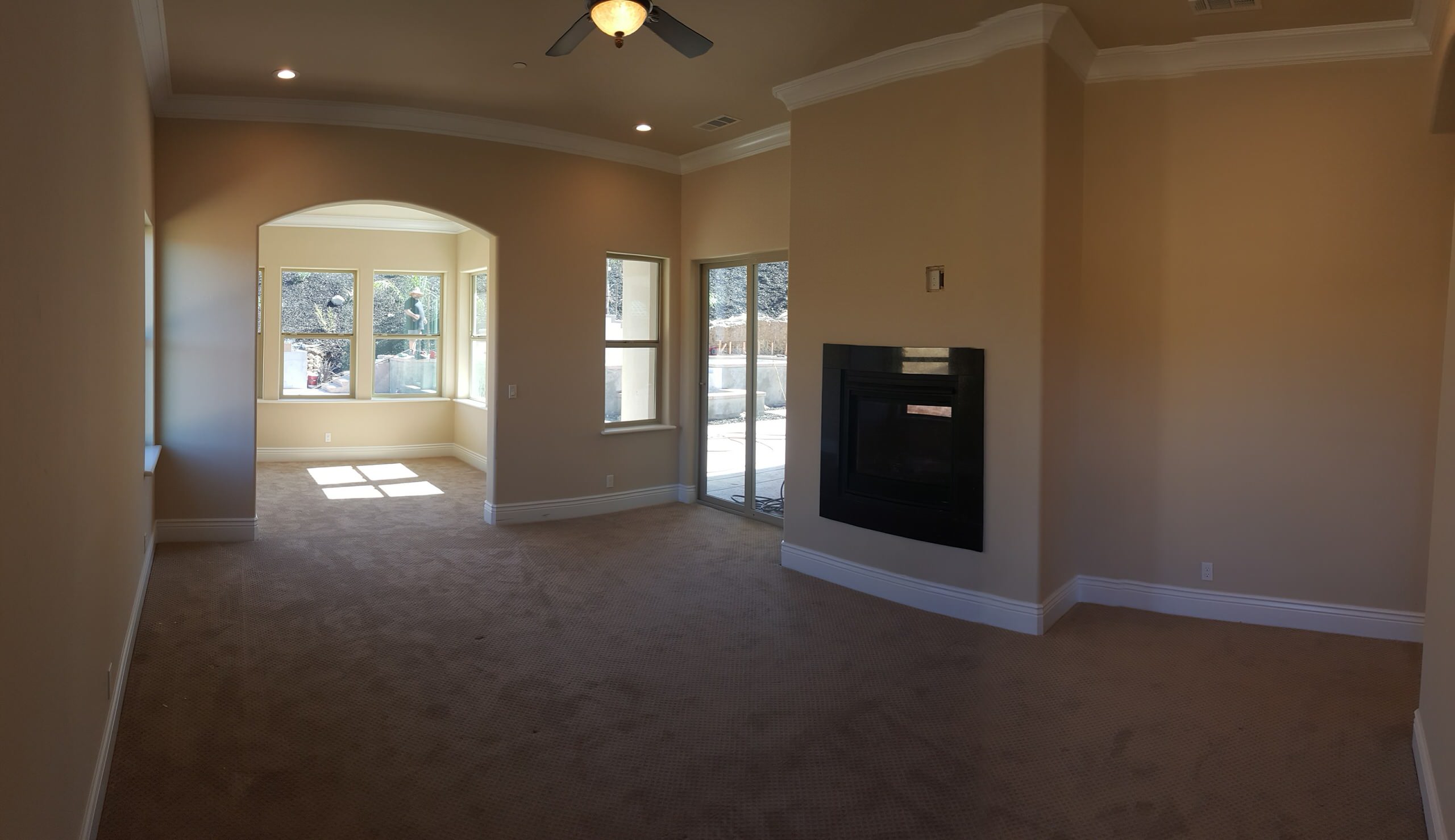 Private room with a fireplace and garden-facing windows
