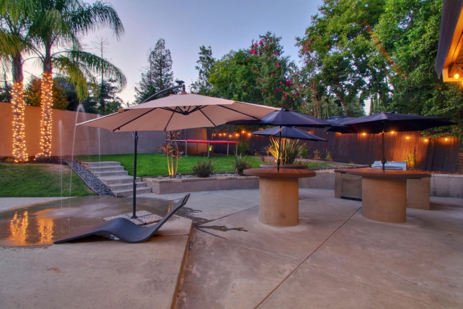 Outdoor gathering spaces shaded by umbrellas