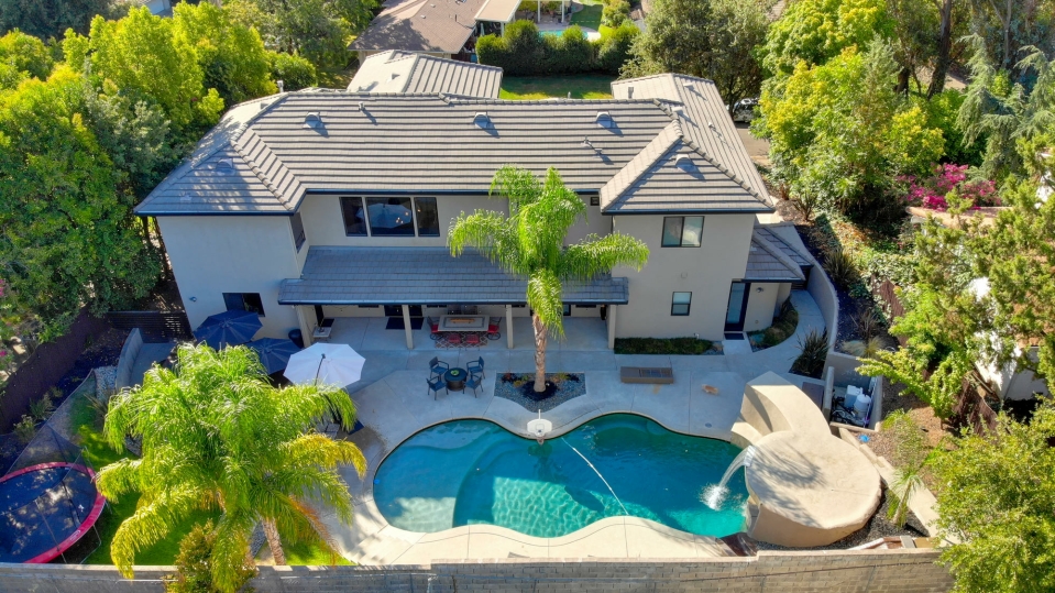Aerial view of the rear elevation and pool courtyard