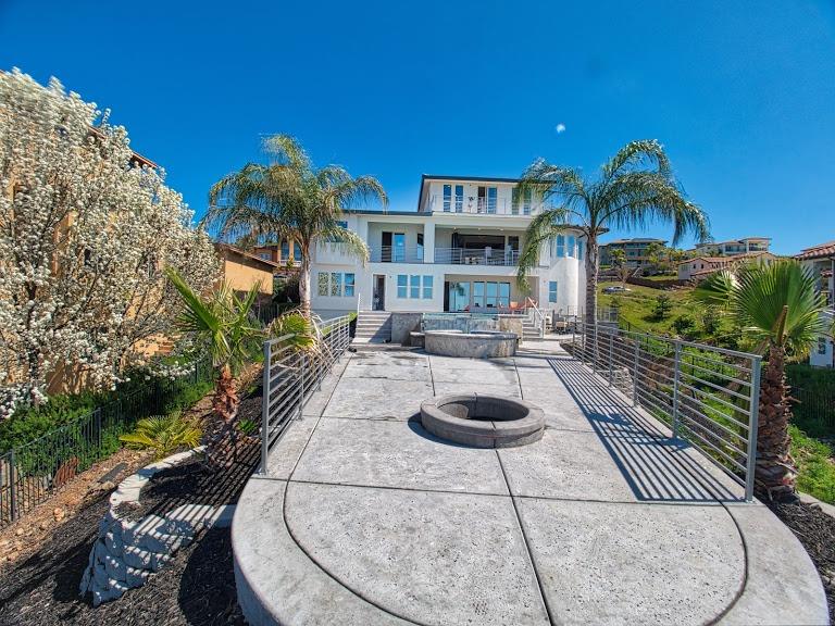 Rear courtyard and outdoor living spaces at the Serpa Residence
