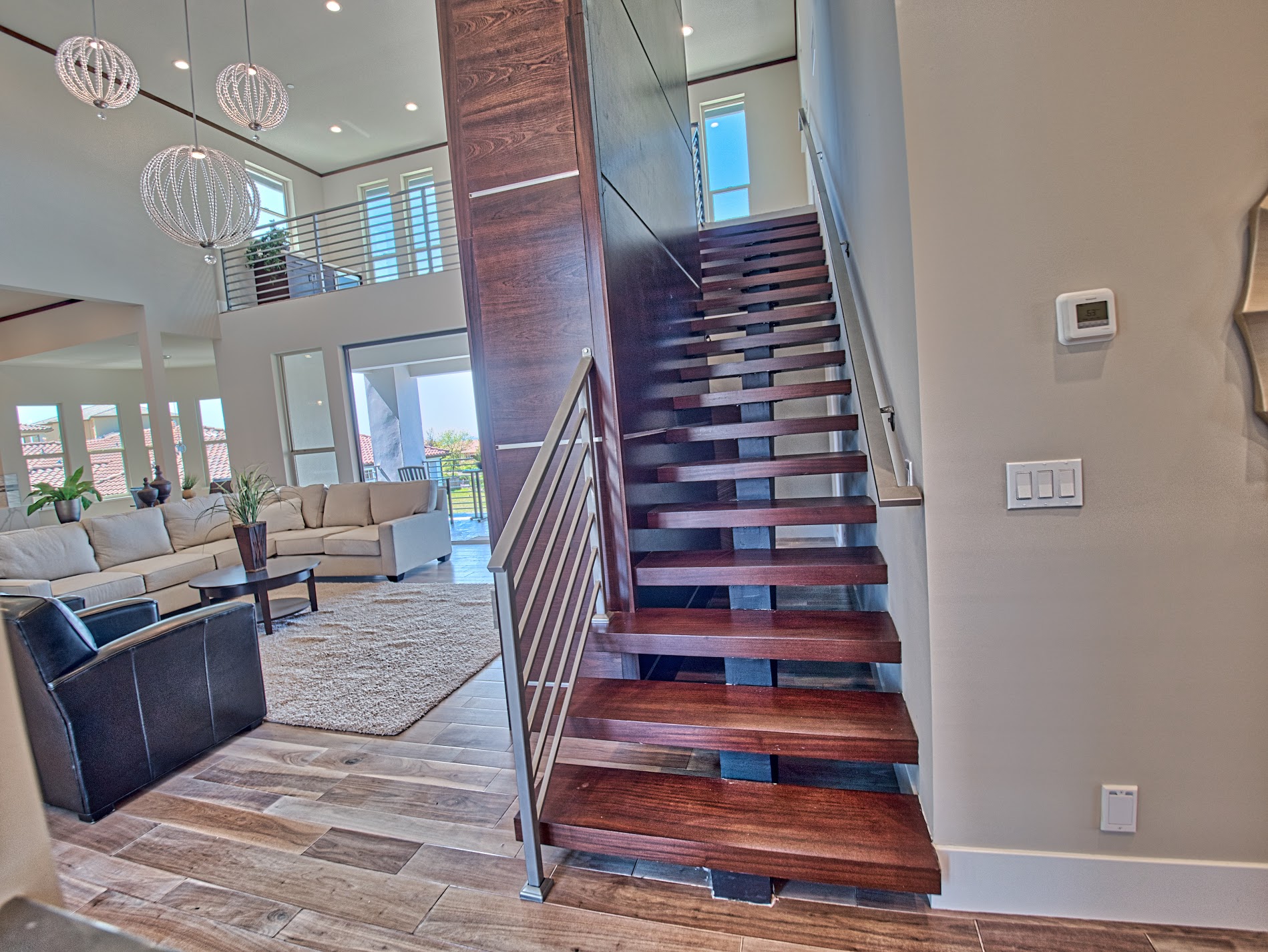 Floating wood stair beside the great room