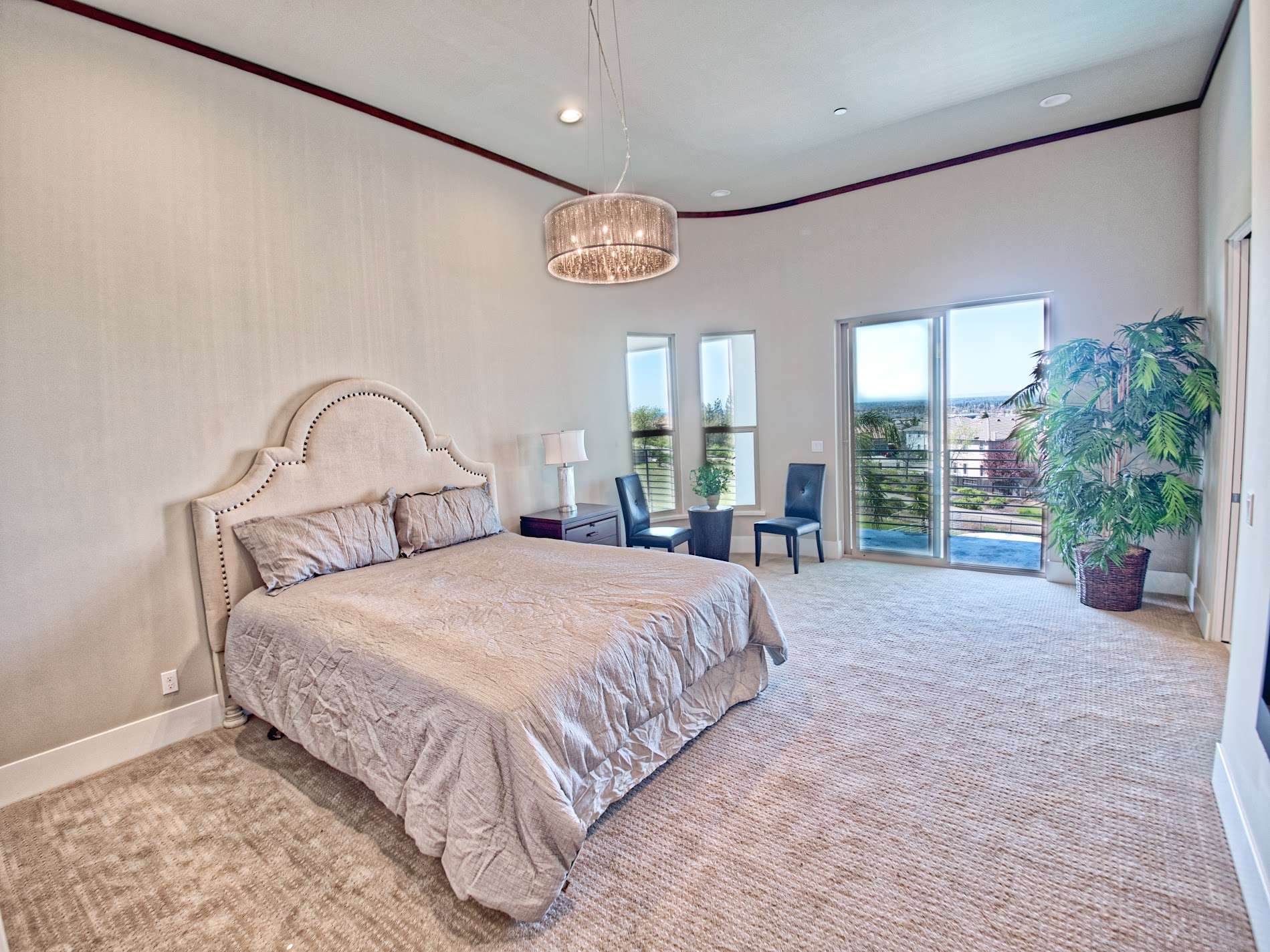 Primary bedroom opening to a private balcony