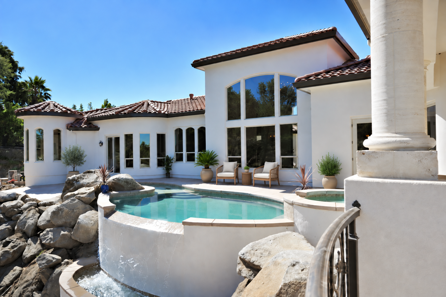 Rear terrace overlooking the pool and natural rock landscape