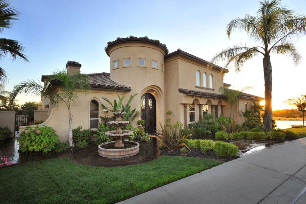Landscaped entry and curved tower at the Waterfall House