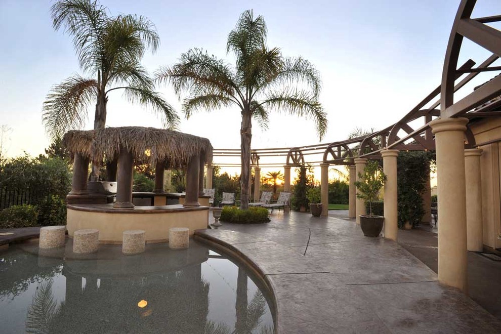 Pool terrace with a palapa and curved timber colonnade