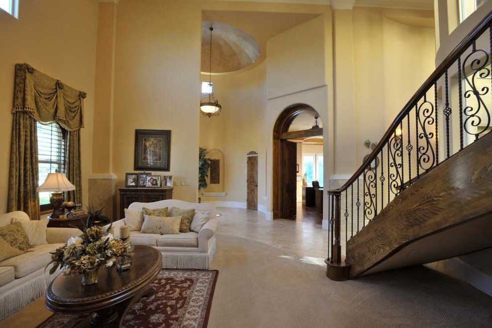 Double-height great room with a sweeping staircase