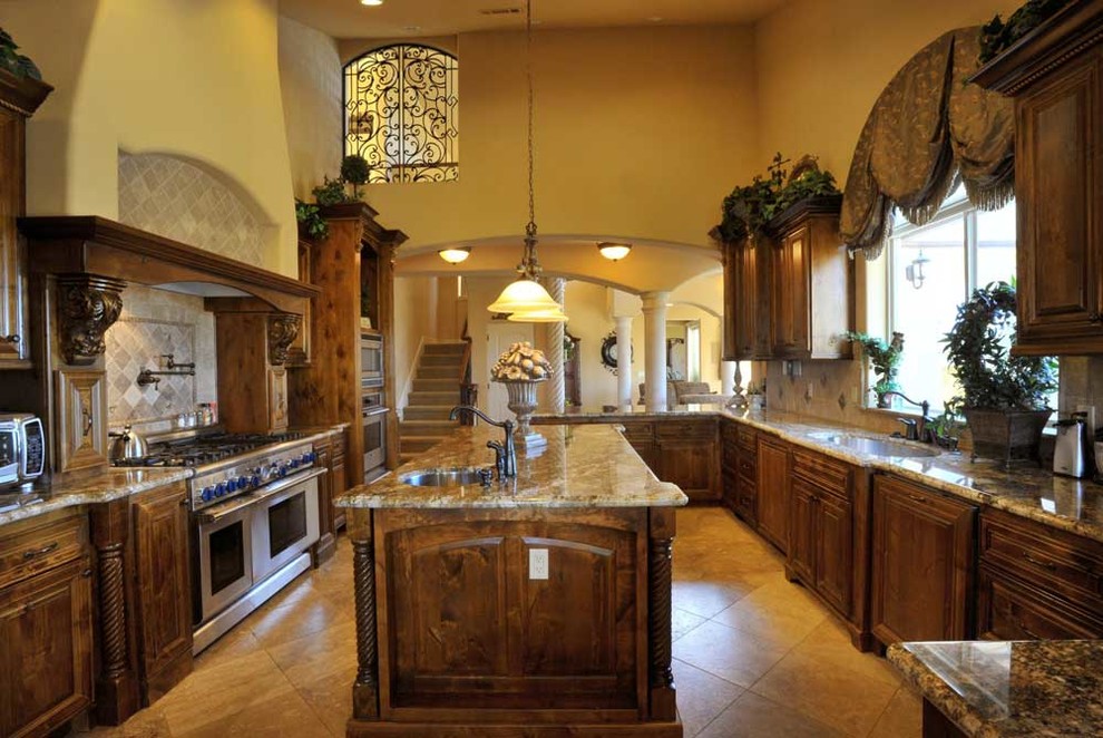 Custom Mediterranean kitchen with richly detailed cabinetry